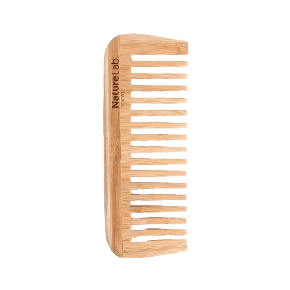 Bamboo comb with 'Nature Lab' branding on a white background