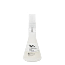 White spray bottle labeled 'Perfect Clean' on a white background