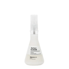 White spray bottle labeled 'Perfect Clean' on a white background