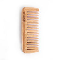 Bamboo comb on white background