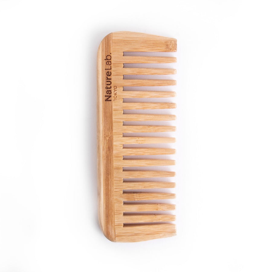 Bamboo comb on white background