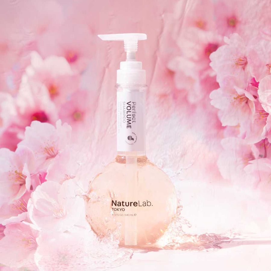 Volume Shampoo on pink, flower background.
